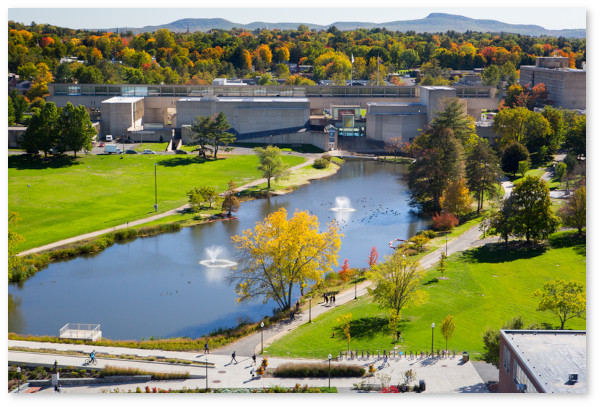 View of campus pond near the Fine Arts Center with Campus Center in the background